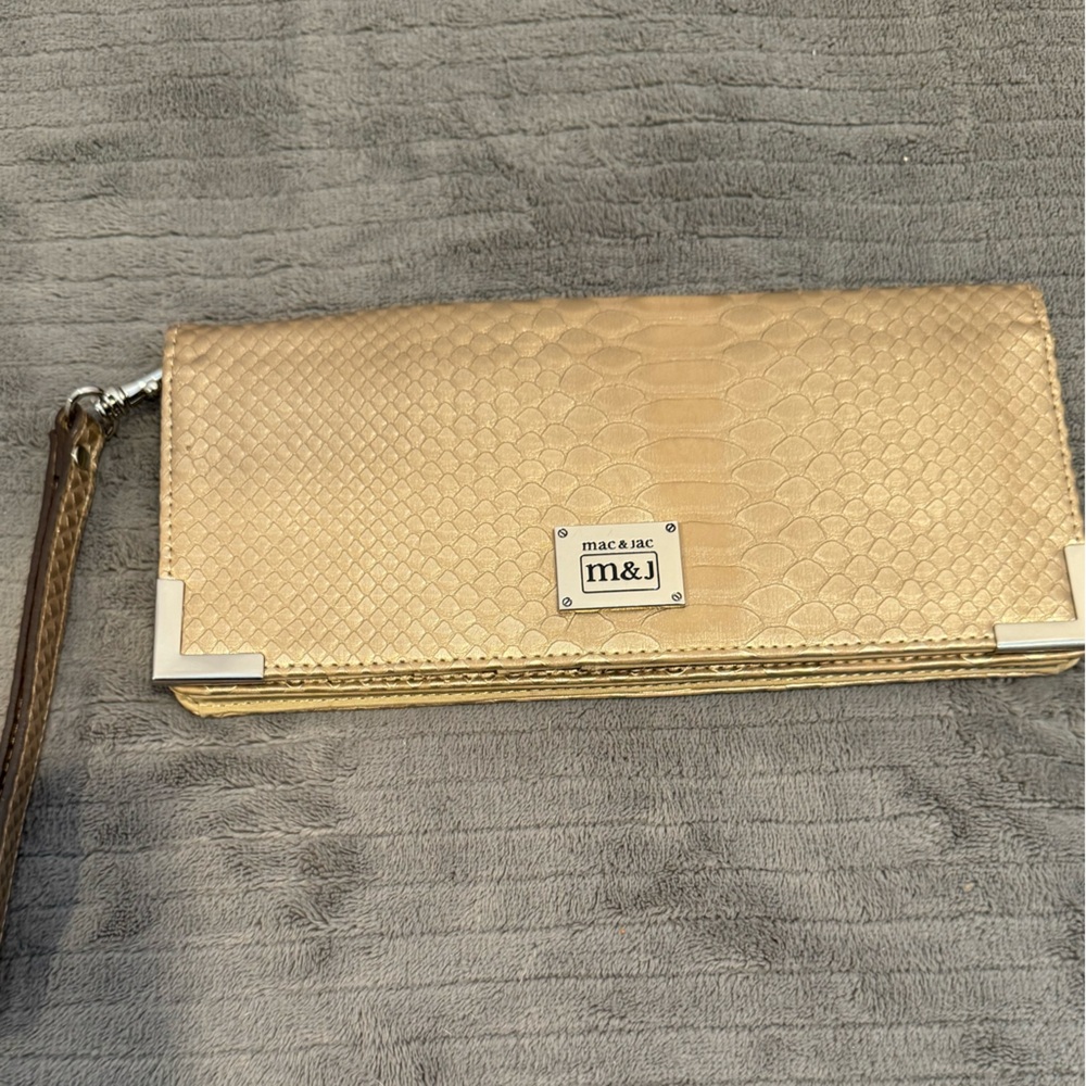 Gold color M & J (Mac & Jac) wallet very good condition looks unused.wrist strap